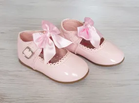 Pink patent bow shoes